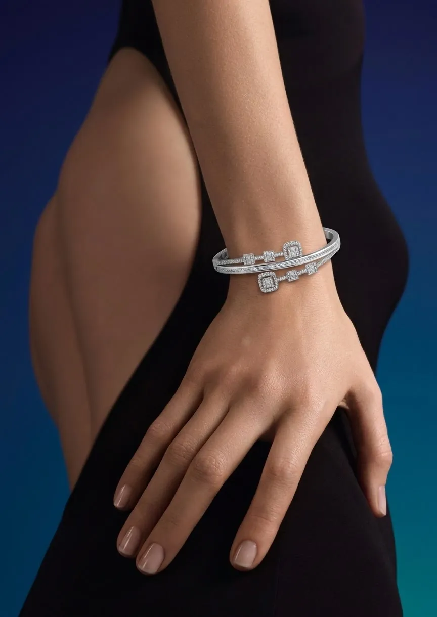 Diamond cuff bracelet on a model's wrist against a deep teal background